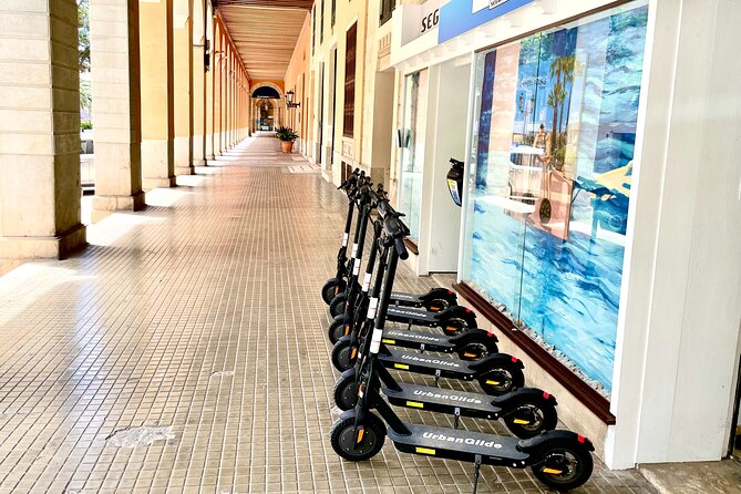 1.5 H Electric Kick-Scooter Tour - Can Pere Antoni beach and a change of scenery