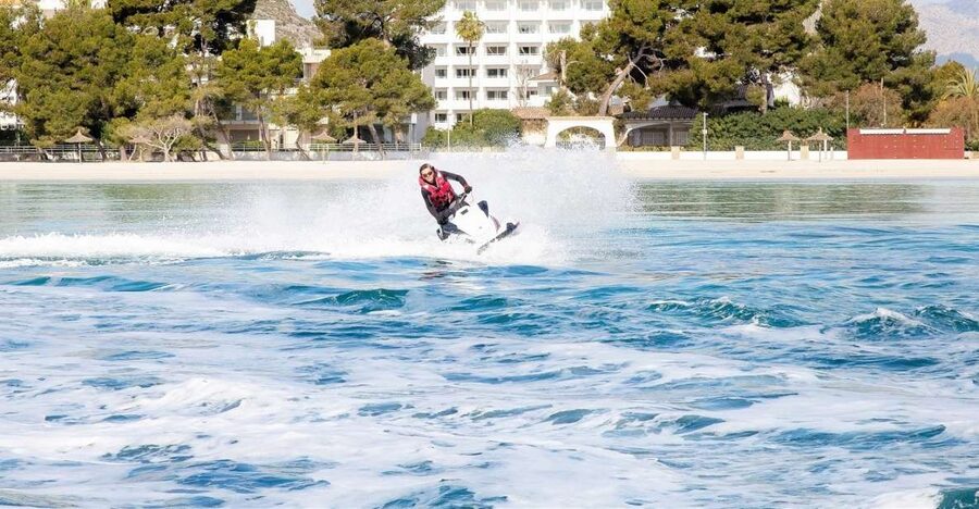 Alcudia: 30-Minute Jet Ski Adventure for Beginners & Photos - Following Alcudia’s long beach into clearer water