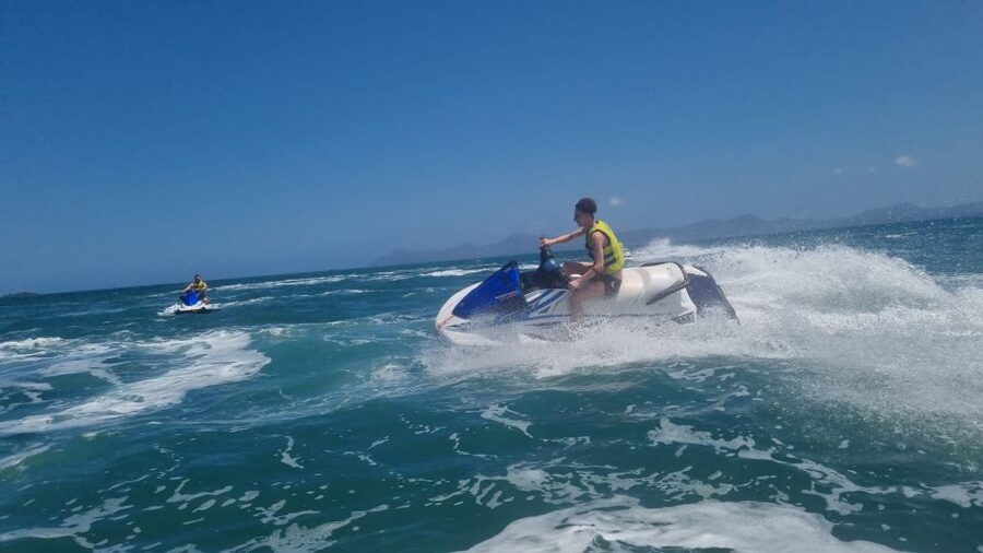 Alcudia: 30-Minute Jet Ski Adventure for Beginners & Photos - Riding tandem and taking turns at the controls