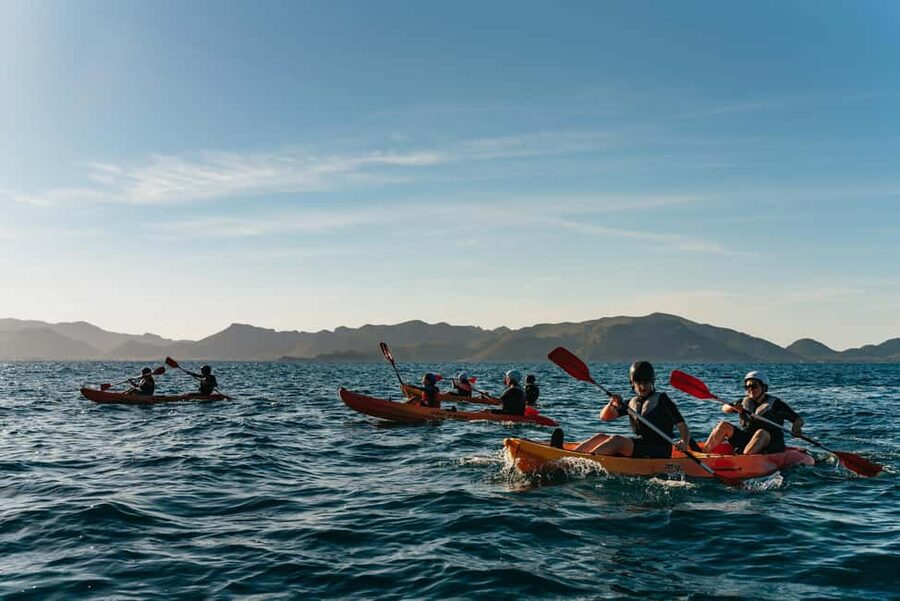 Alcudia: Guided Sea Kayaking Tour with Snorkeling - Entering the sea caves