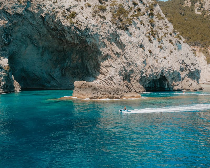 Alcudia: JetSki Tour Coll Baix beach & Caves (free Photos) - Alcanada lighthouse and the first photo stop