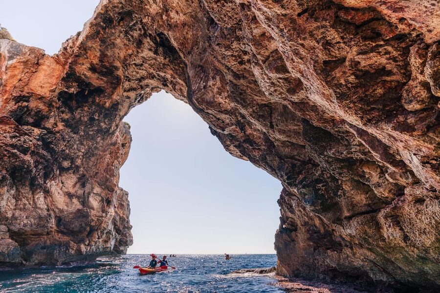 Cala Varques: Guided Sea Caves Kayak & Snorkeling Expedition - Paddling past Cala Falcó and the coastal cliffs