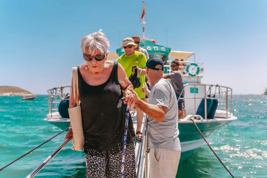 From Magaluf: Palma Bay Sightseeing Cruise with Live Music - A swim stop in clear coastal water