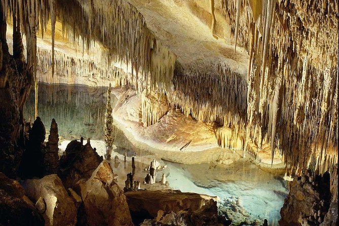 Guided Full-Day Tour of Drach Caves, Porto Cristo & Pearl Factory - Entering the Drach Caves and Lake Martel