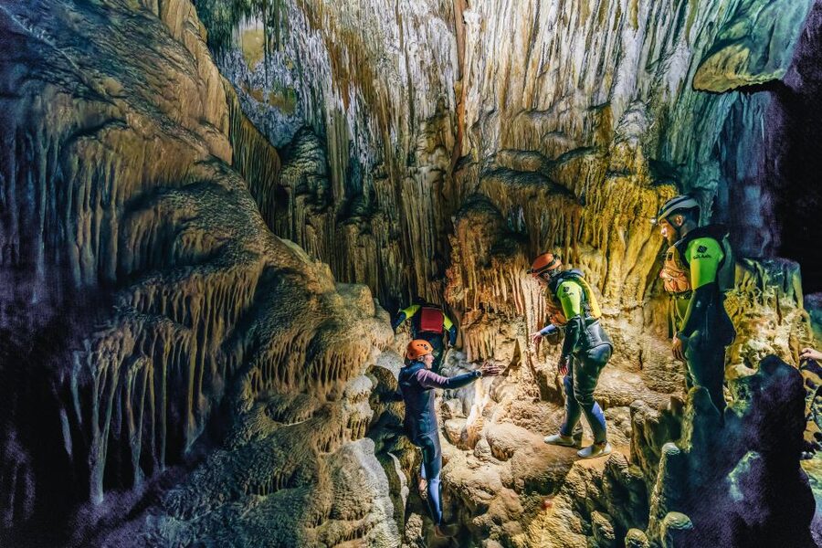 Mallorca: Cova des Coloms Caving Trip with Hotel Transfer - Inside the cave: limestone, climbing, and natural lakes