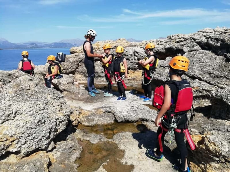 Mallorca Half-Day Coasteering Experience - Abseiling down the cliff toward the water
