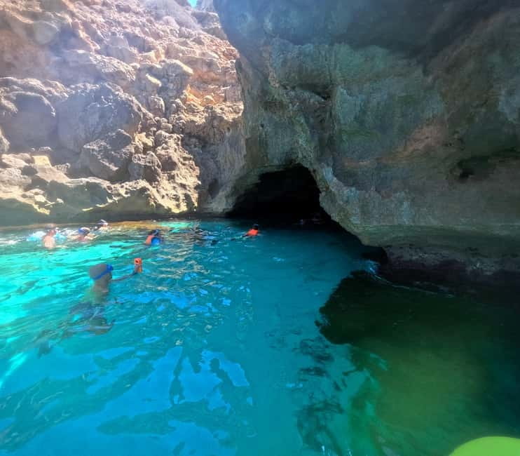 Mallorca: Sea Cave Kayaking Tour with Snorkeling and a Snack - Entering the caves and reading the coast from sea level