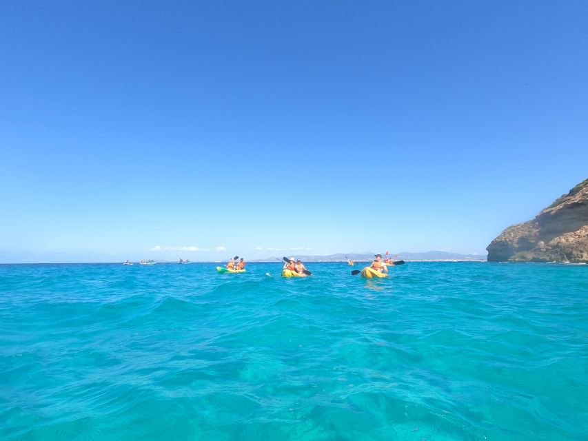Mallorca: Sea Cave Kayaking Tour with Snorkeling and a Snack - Swimming stops, rocks, and optional thrills
