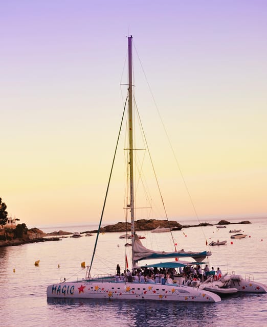 Palma de Mallorca: Sunset Sailing Catamaran Trip with Drink - The first view of Palma Cathedral from the water
