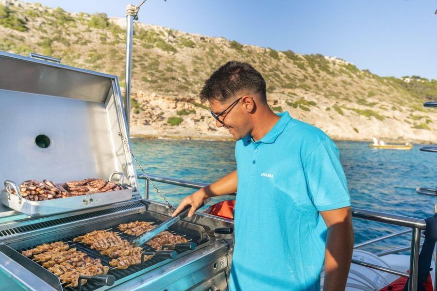 S'Arenal: Sunset Catamaran Cruise with BBQ - The coast toward Cap Enderrocat and Cala Vella
