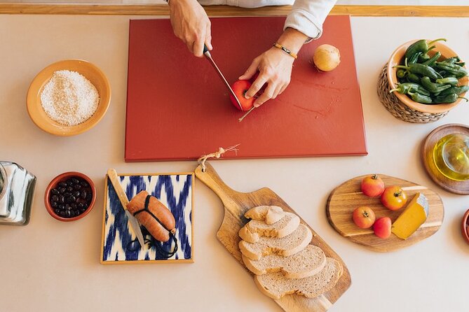 Spanish Cooking Experience in Mallorca - Sitting down at the big Mediterranean table