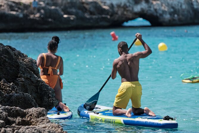 Tour Beach Portal Vells, Cave Portal Vells. - Playa de Portal Vells: sand, shallow water, and early arrival